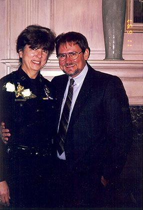 Connie and husband Jon celebrate with an unauthorized uniform accessory – a corsage